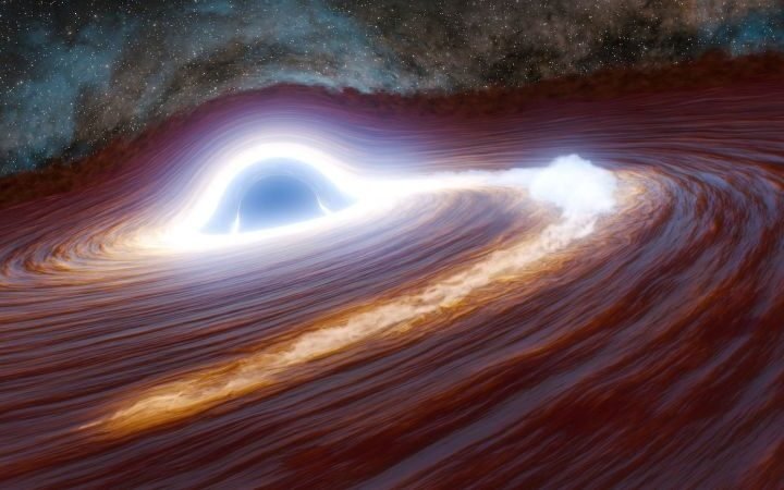 Astronomers detect unprecedented flare from distant black hole, shining like 10 trillion suns