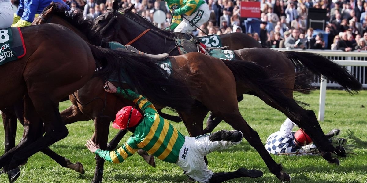 Jockey Robbie Dunne taken to hospital after serious fall at Grand National