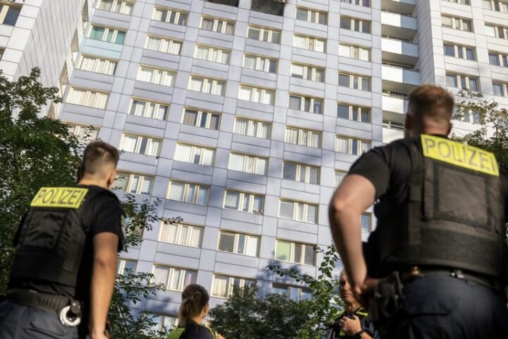 Woman leaps from burning Berlin high-rise to safety in dramatic rescue